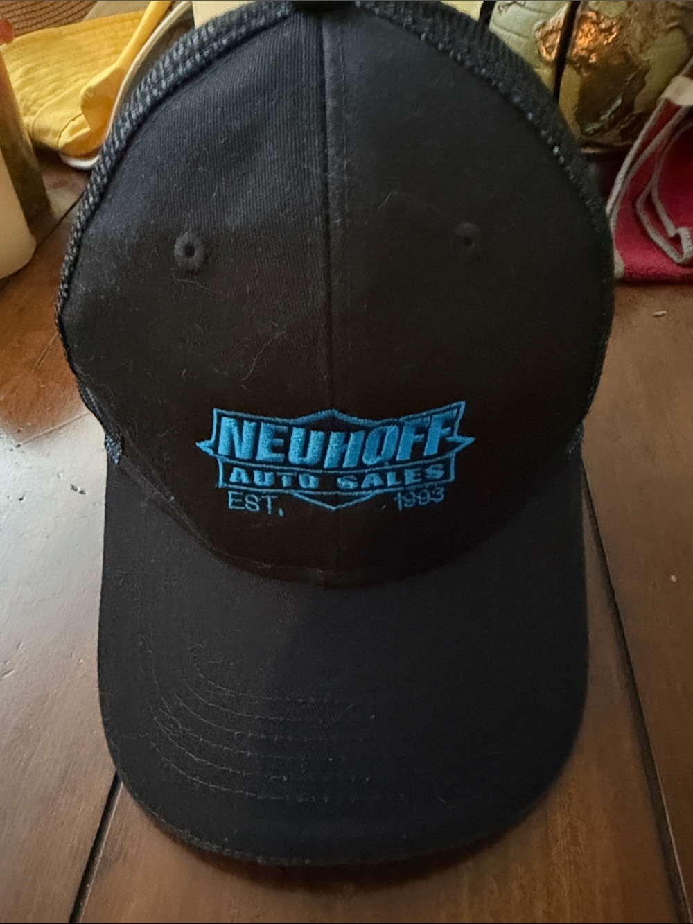 Neuhoff Auto Sales Black Trucker Hat with Blue Logo